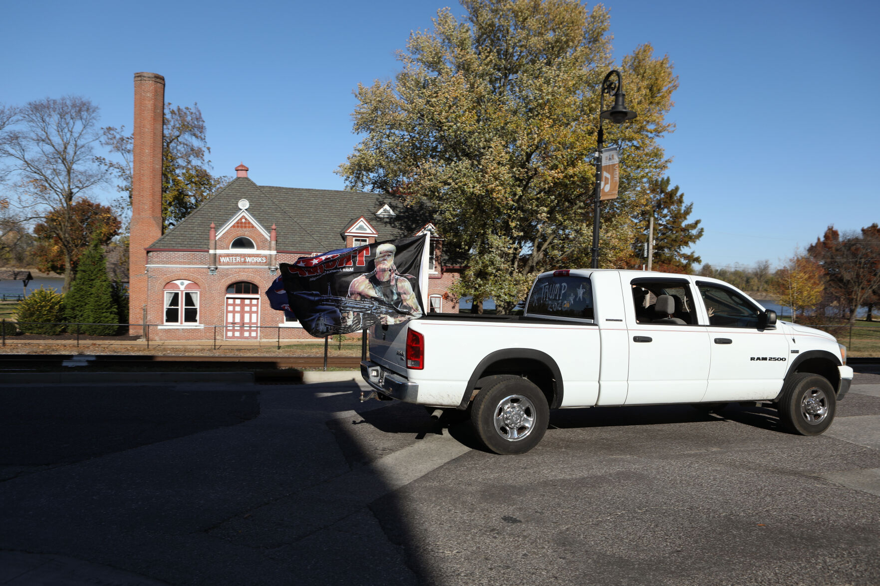 A truck rolls through Front St. on the "Trump Train"